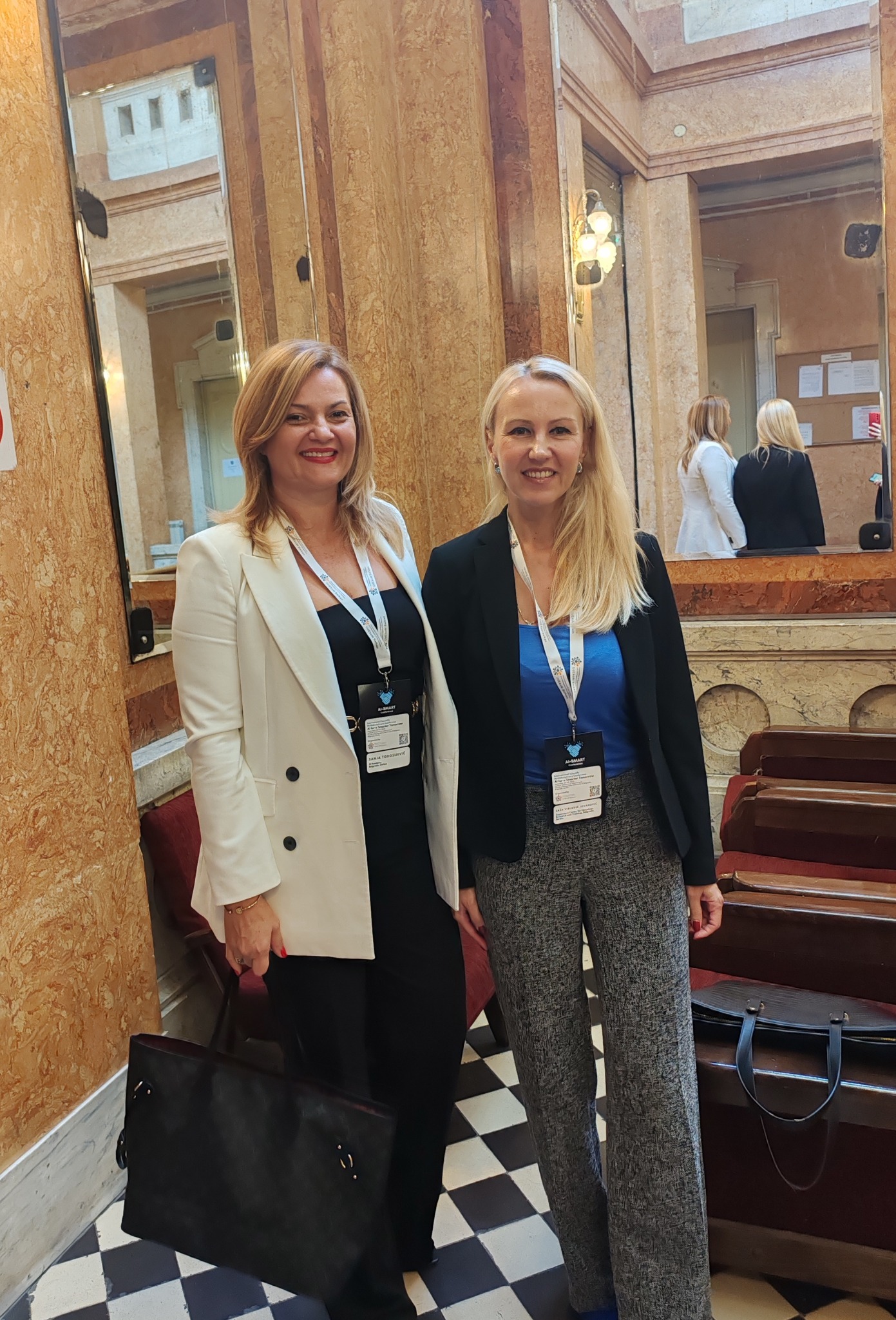 Sanja Todosijević and a fellow professional at a conference